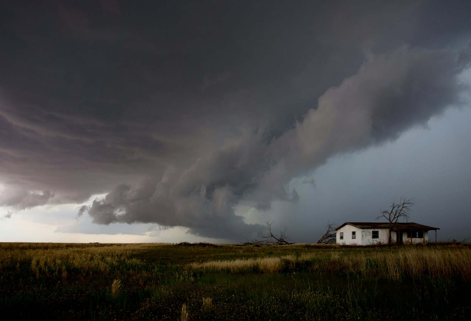 Storm front building over a single-family home