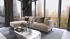 Modernes Wohnzimmer mit beigem Ecksofa, Couchtisch und großen Fenstern mit Blick auf eine Stadtlandschaft.