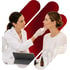 White-coated doctor performs medical aesthetics on a woman's jawline.