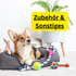 Corgi liegt in einem Hundebett mit Spielzeug und Text "Zubehör & Sonstiges".