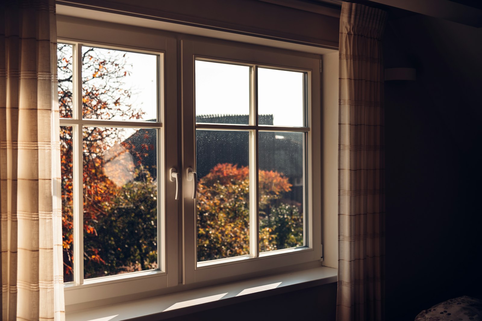 Double-pane insulated glass unit in a sound window frame
