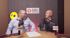 Two men, one bald with glasses, one with dark hair, sit at a table with microphones, "Ask the Surveyor" logo behind them.