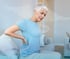 Woman experiencing sciatica pain in her lower back.