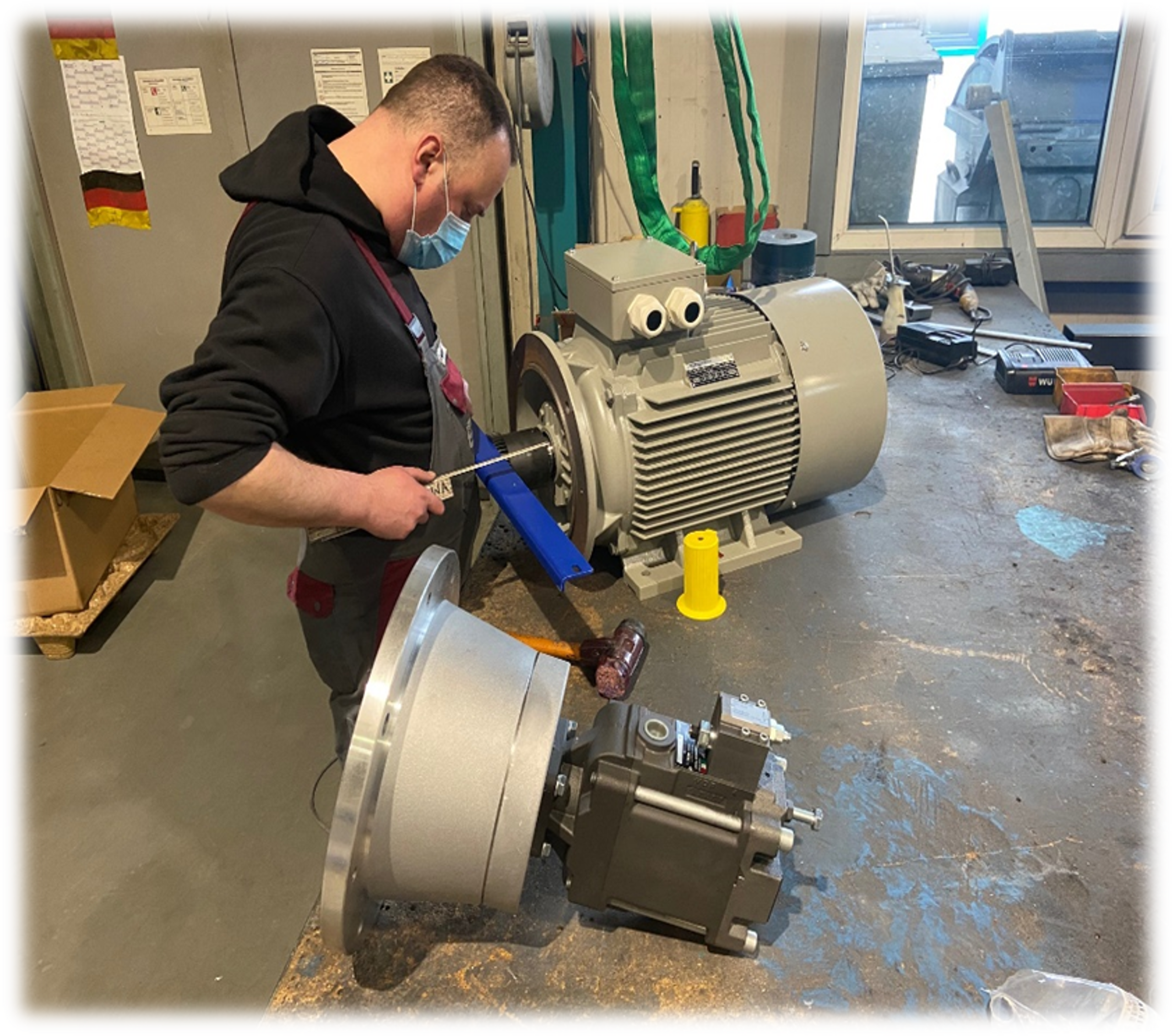 Technician installing an electric motor
