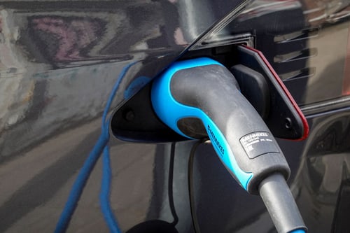 EV charger cable plugged into an electric vehicle during an EV charger installation in Orange, CA
