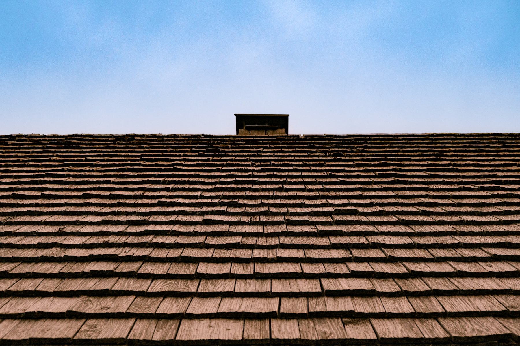 Roofline against open sky across the Parker County service area