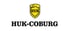 HUK-COBURG Logo: Gelbes Schild mit "HUK" und stilisierter Burg, darunter "HUK-COBURG" in Schwarz.