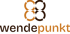 Logo mit vier ineinandergreifenden Ringen über dem Schriftzug wendepunkt in Braun und Orange auf schwarzem Grund.