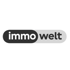 ImmoWelt Logo: „immo“ in weiß auf schwarzem Oval, „welt“ in schwarz auf hellem Oval, beide verbunden.