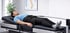 Man lying on a table for spinal decompression therapy.