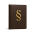 Braunes Buch mit einem goldenen Paragraphenzeichen auf dem Einband.