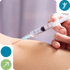 Person's arm receiving a nerve block injection from a syringe.
