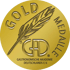 Goldmedaille der Gastronomischen Akademie Deutschlands E.V. mit Schreibfeder und GAD-Logo auf goldenem Grund.