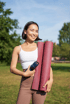Smiling woman enjoying outdoor fitness while managing hip pain