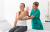 Chiropractor providing spinal decompression therapy for shoulder pain