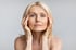 A serene, middle-aged woman with youthful skin looking ahead.