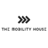 Logo: Drei schwarze, gestapelte Chevron-Pfeile zeigen nach rechts über dem Text "THE MOBILITY HOUSE" auf dunklem Hintergrund.