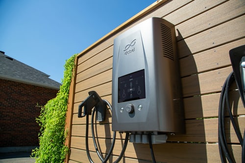 Wall-mounted Level 2 EV charger at a home in Lake Forest, CA, weighing whether to install an EV charger yourself or hire an electrician