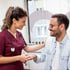Friendly nurse chats with a patient at our wellness center.