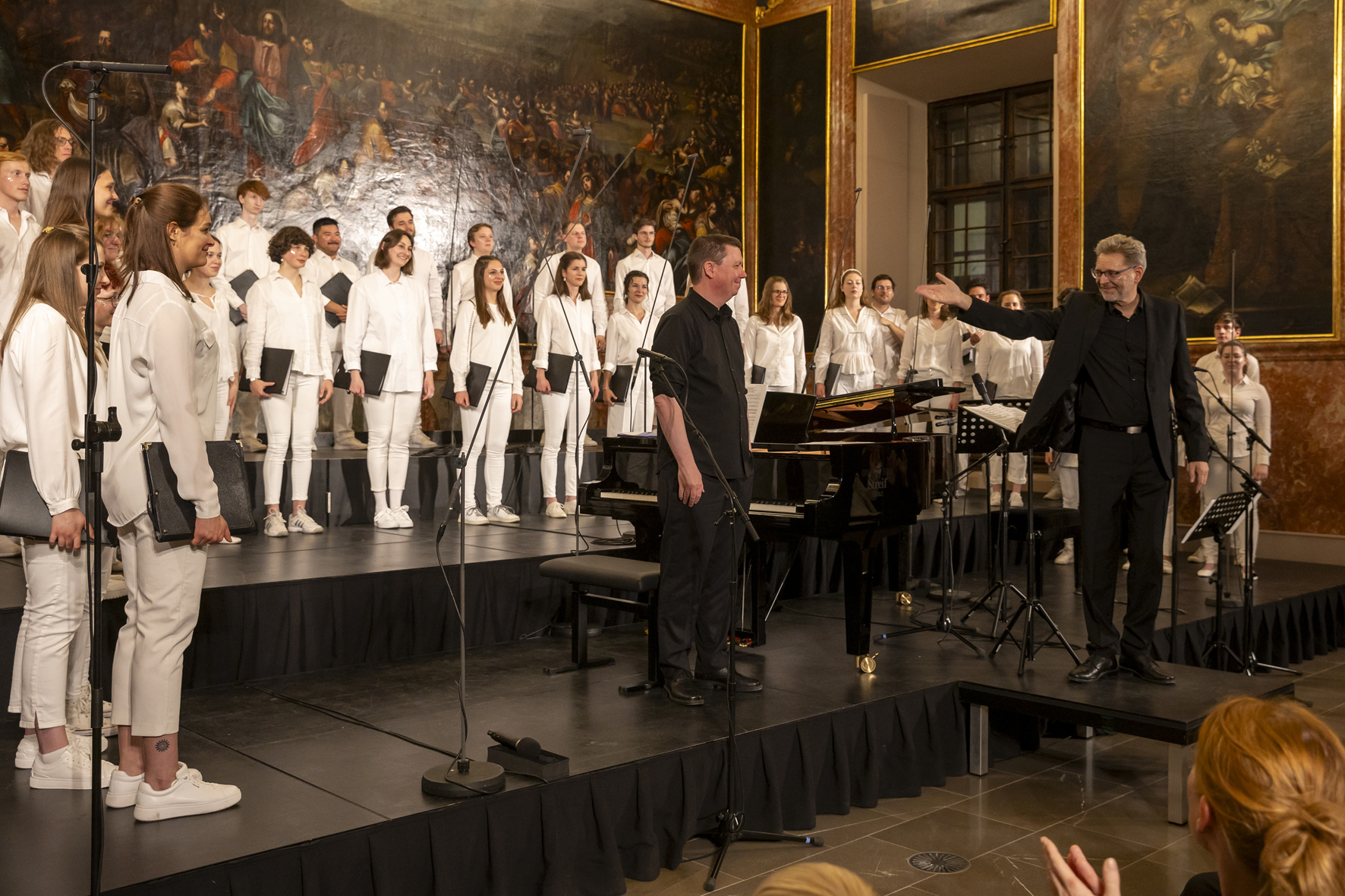 Jugendchor Österreich and Ola Gjeilo taking their applause in the Minoritensaal, Voices of Spirit 2024, Graz