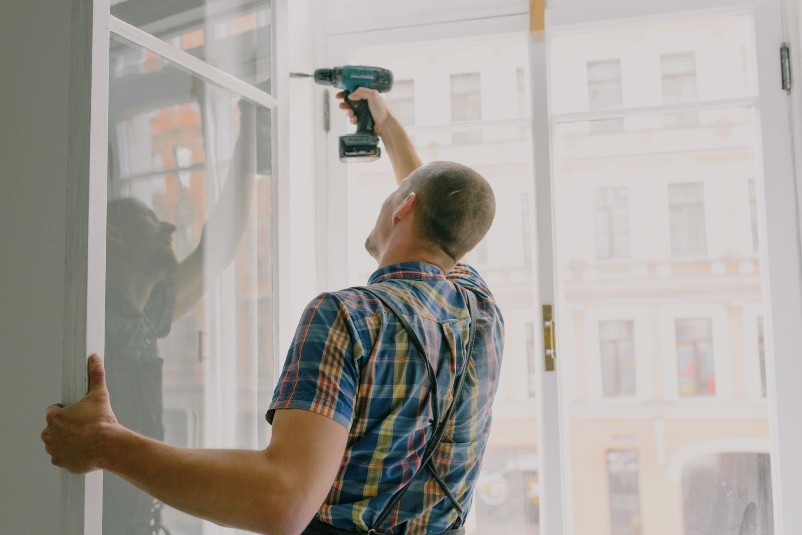 Installer working on a replacement window opening