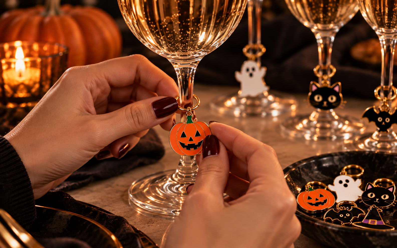 Halloween charm attached to a wine glass stem