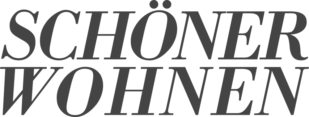 Text "SCHÖNER WOHNEN" in dunkelgrauer Schrift auf grünem Hintergrund.