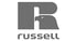 Graues Russell Logo mit einem stilisierten Buchstaben R, in dessen Aussparung ein Adlerkopf integriert ist.