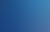 Ein Mann mit Brille und Headset, der vor einem blauen Banner mit dem Wort „SUMMIT“ spricht.