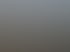 Blick über die Dächer Münchens bei Sonnenuntergang, mit erleuchteten Gebäuden und einem Turm mit Uhr.