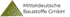 Logo von Mitteldeutsche Baustoffe GmbH, mit einer dreieckigen Form, die aus vielen kleinen Kreisen besteht.