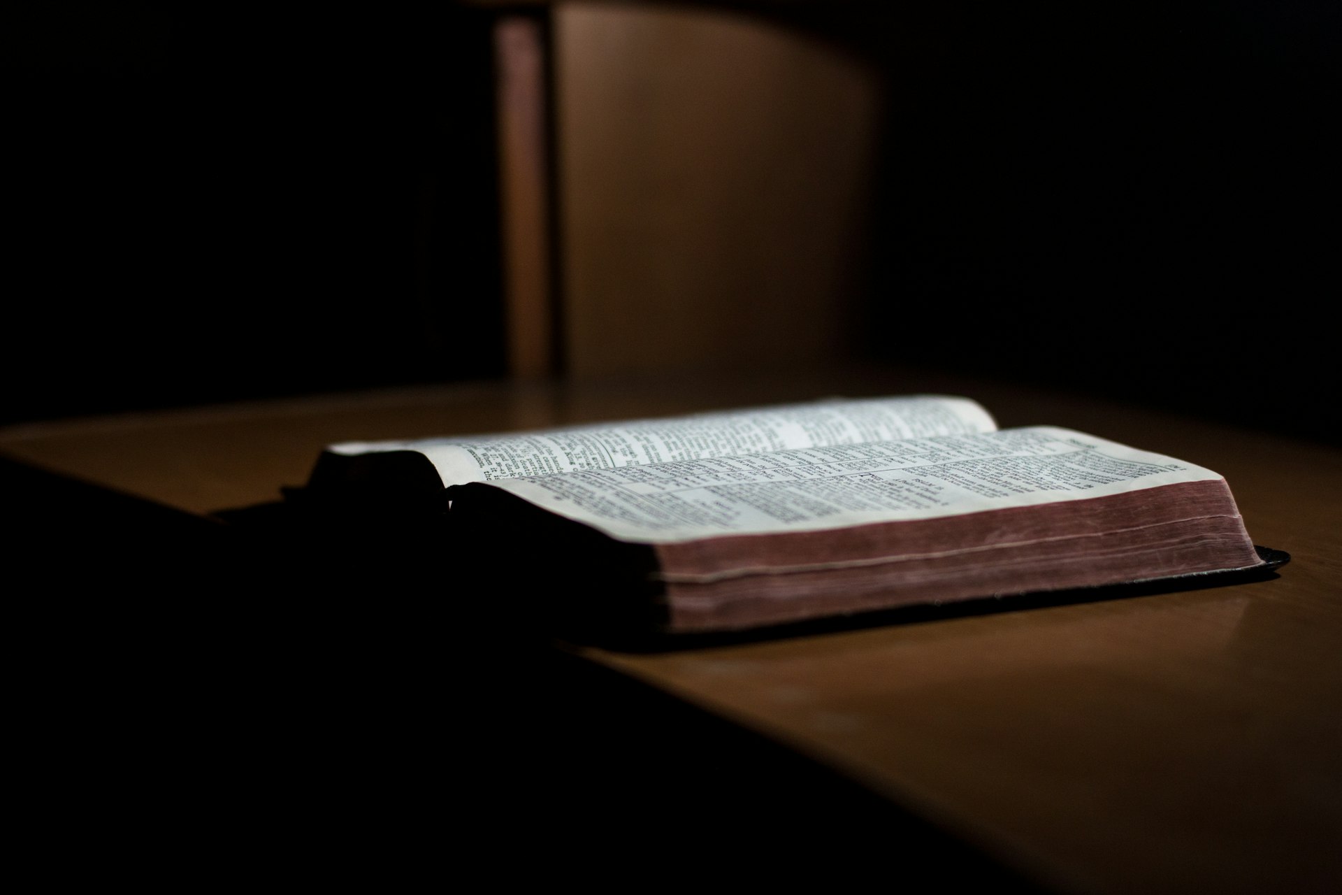 Believers gathered around an open Bible in Southeast Asia
